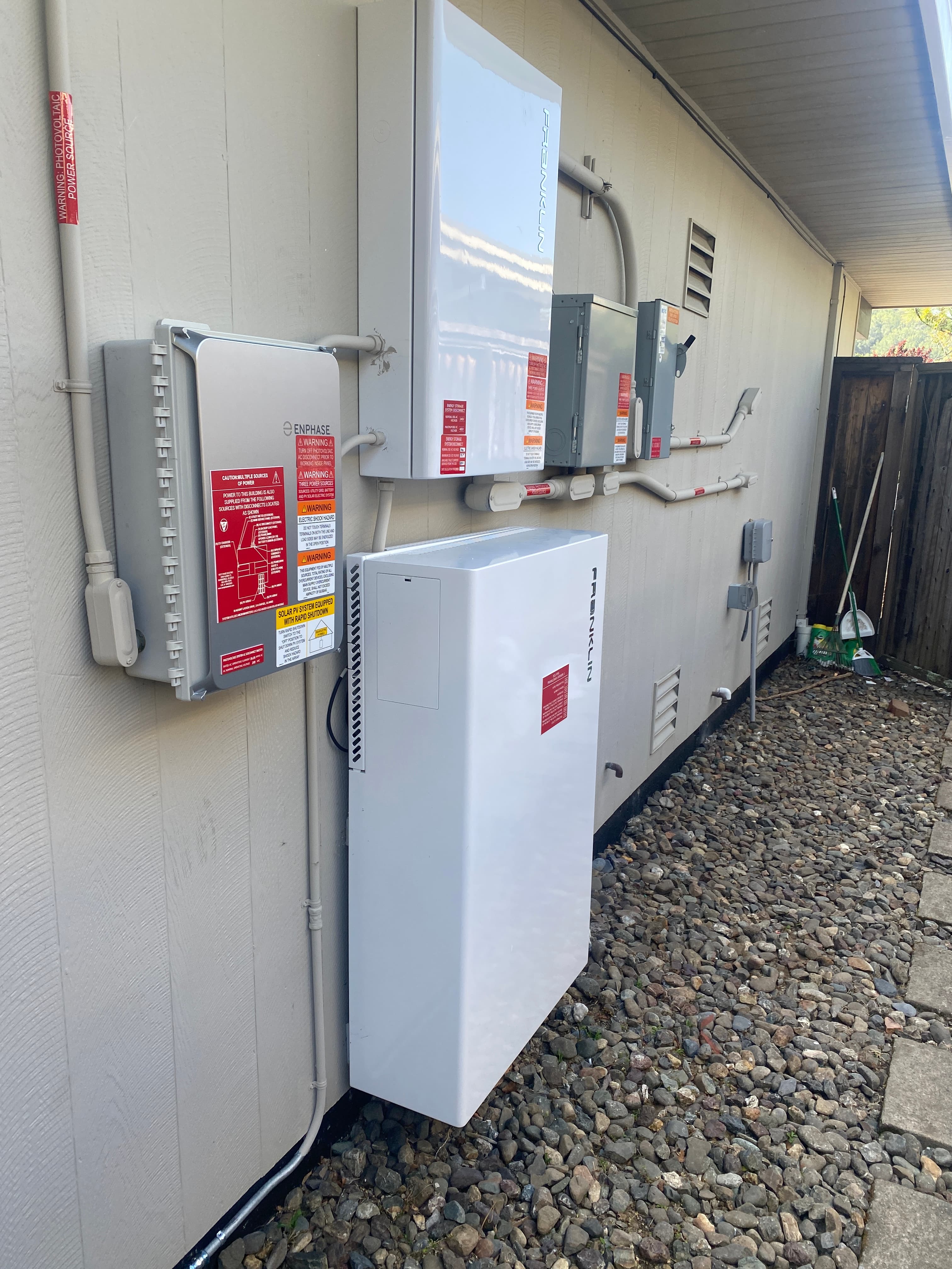 Solar technician reviewing system performance and monitoring